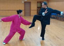 Master Leung practices with student - Tian Liang